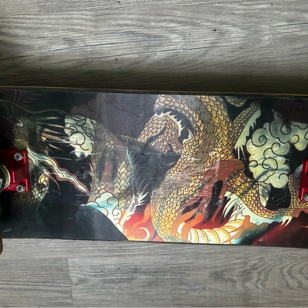 Dragon Design Skateboard with Red Wheels ( DGK )